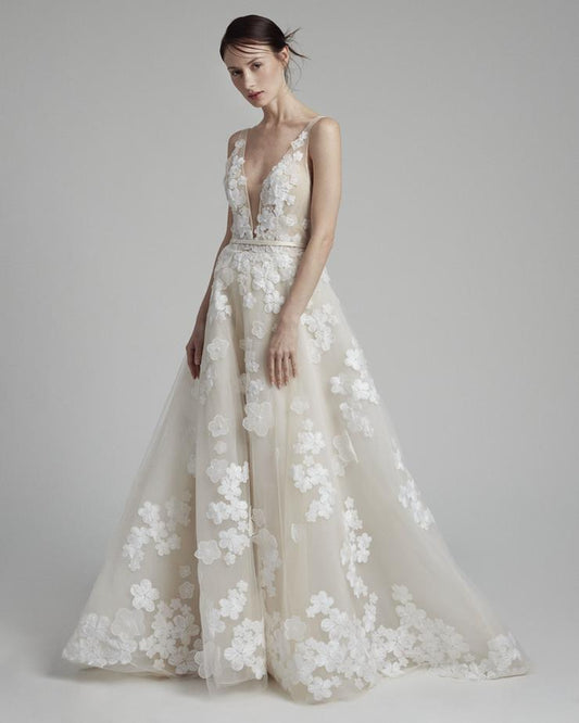 A-line silhouette and plunging V-neck with floral laces and beaded 3D flowers over the entire dress